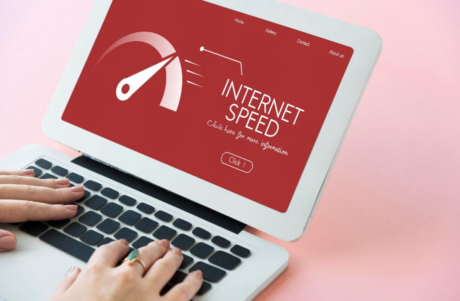 Laptop showing an internet speed test screen, used to troubleshoot slow Wi-Fi connection.