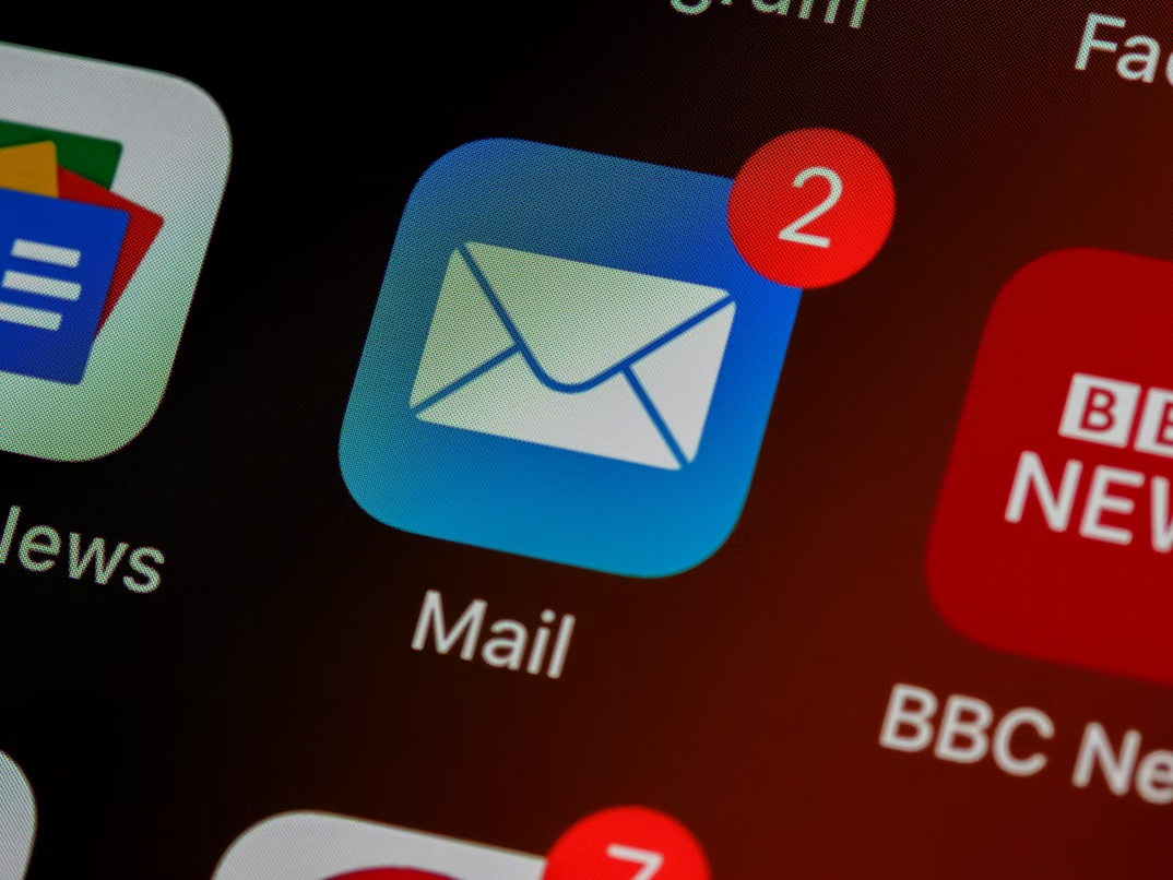 Close-up of a Mail app icon with new email notifications, representing potential phishing emails.