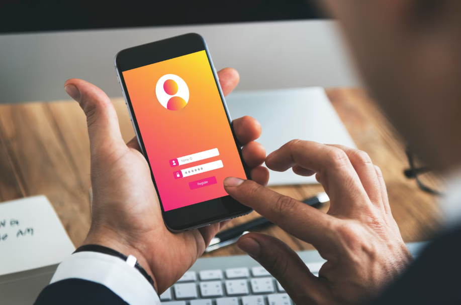 User entering a password on a smartphone login screen, representing the importance of secure password management apps