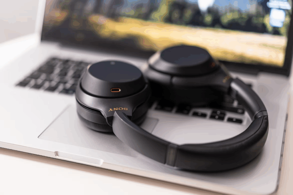 Sony noise-canceling headphones resting on a laptop